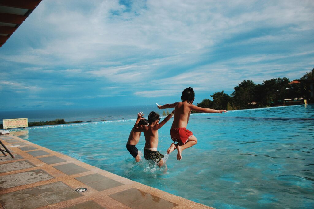 Happy family enjoying a clean salt water pool in Orange County