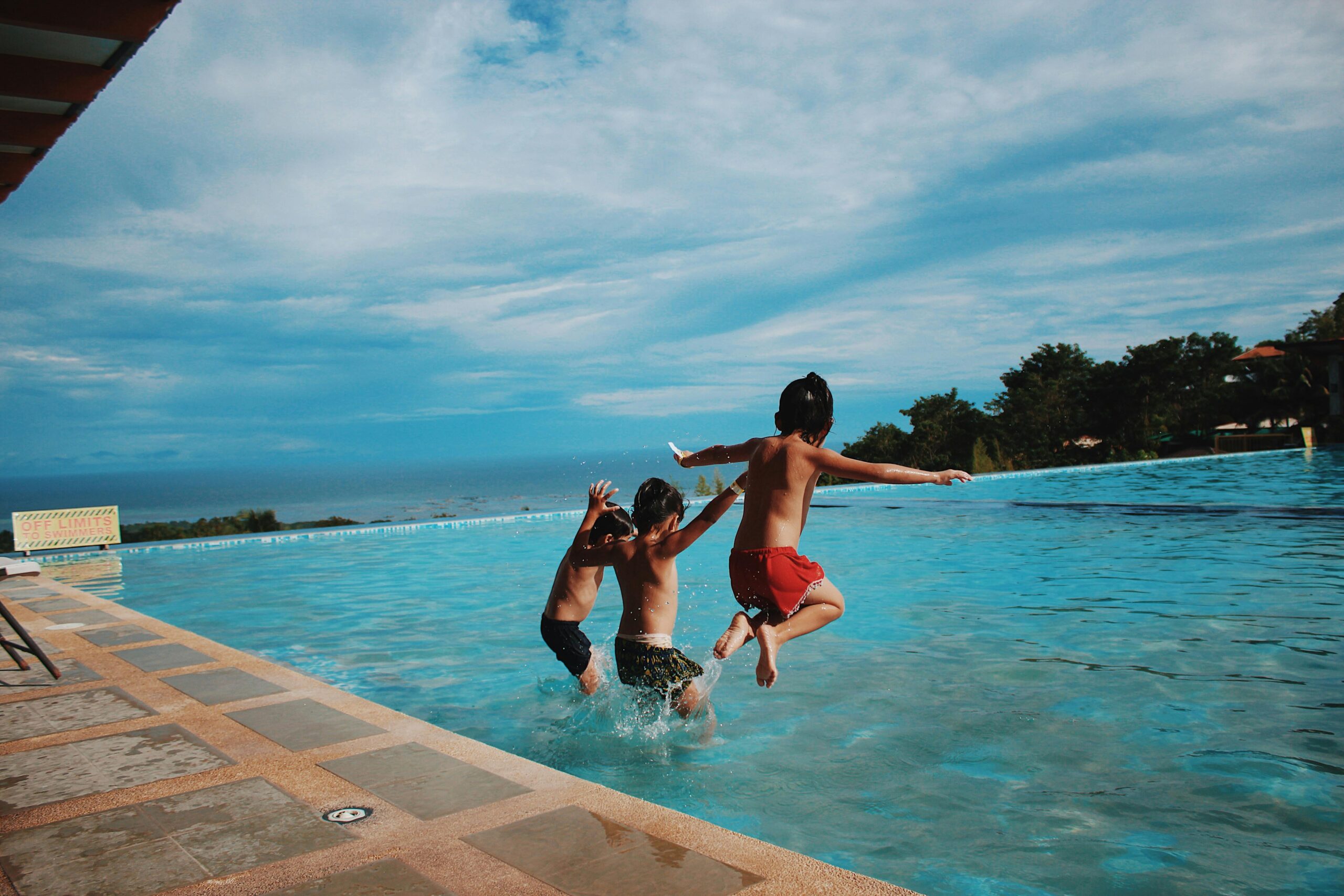 Happy family enjoying a clean salt water pool in Orange County